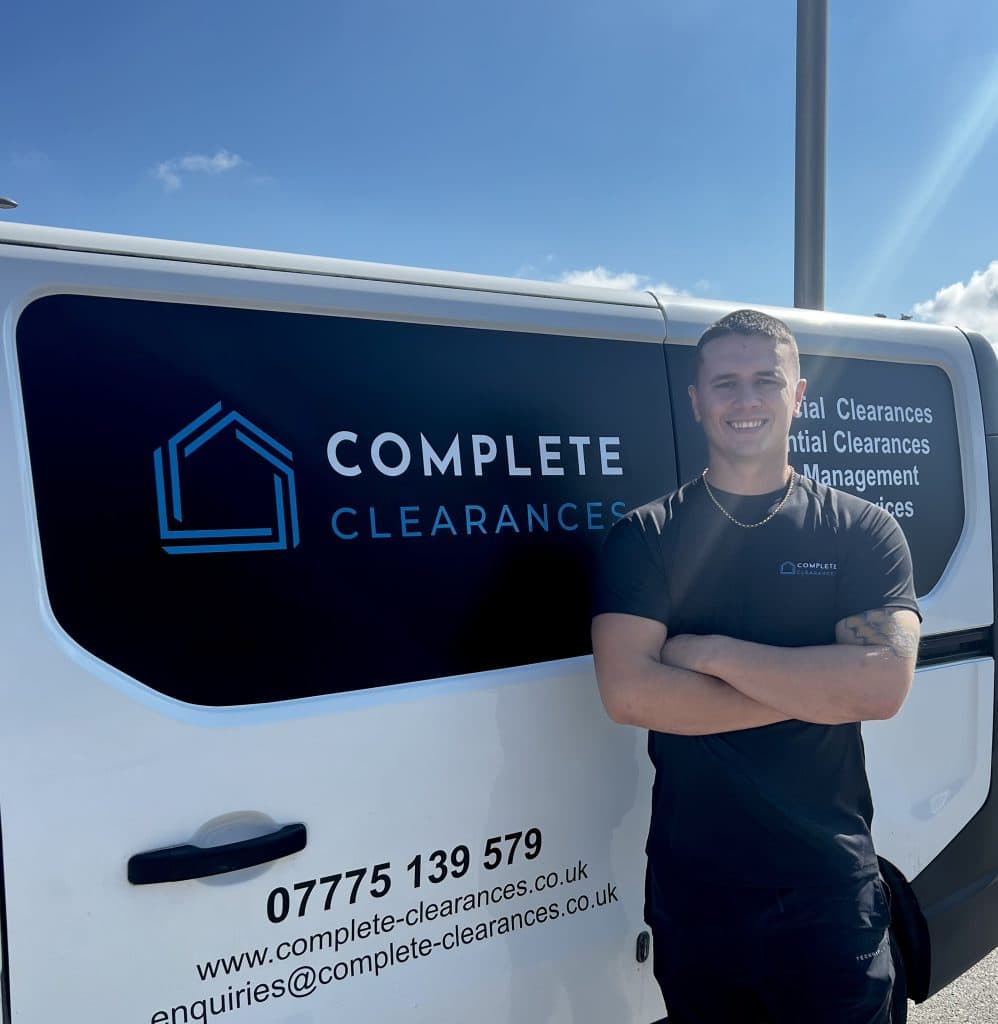 James, founder of Complete Clearances, next to the van